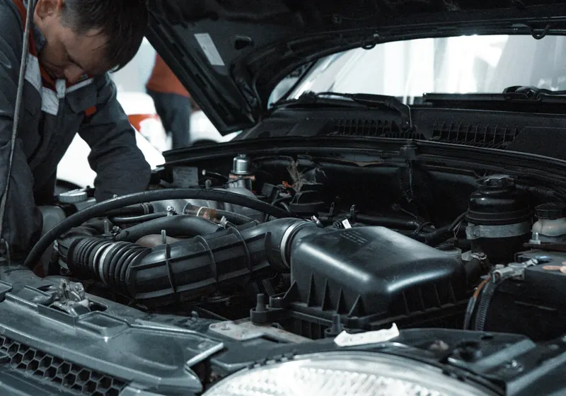 A mechanic inspecting a car engine