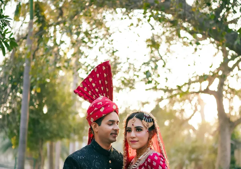 A bride and groom in traditional wedding dress